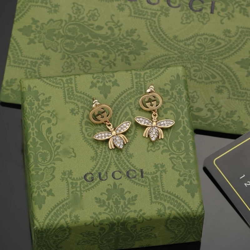 G*u*i earrings